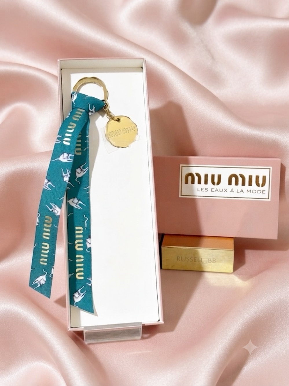 Miu Miu Beauty Teal Cat Design Ribbon Keychain with Gold Charm